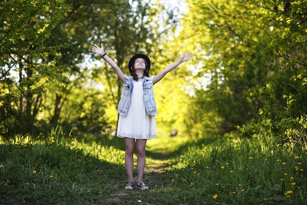 Girl in the park in the evening of a sunny day in the spring