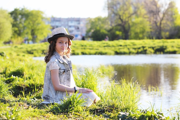 Girl in the park in the evening of a sunny day in the spring