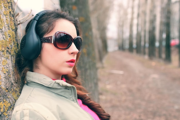 Girl in park with headphone