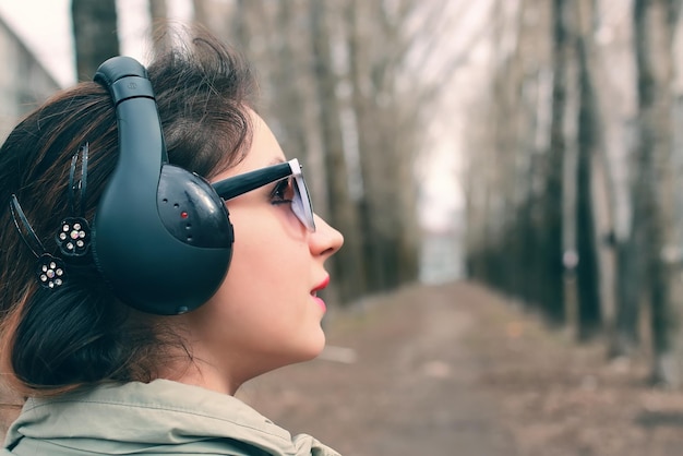 Girl in park with headphone