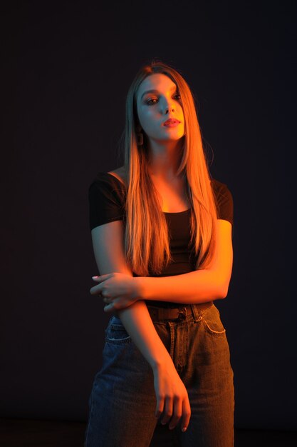 Girl in a photo studio with color filters. 