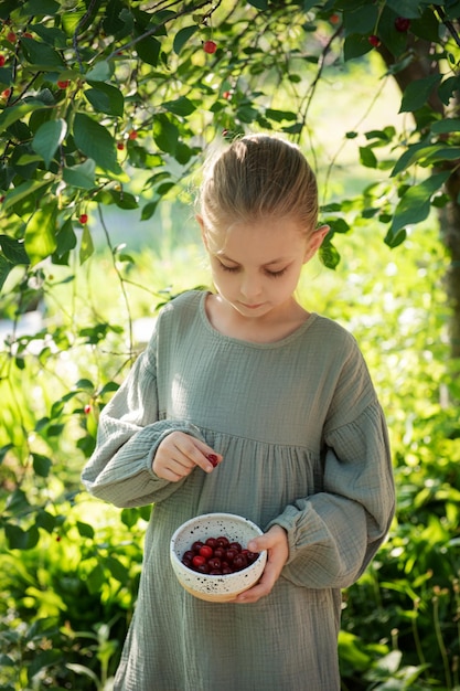 Girl picking cherries