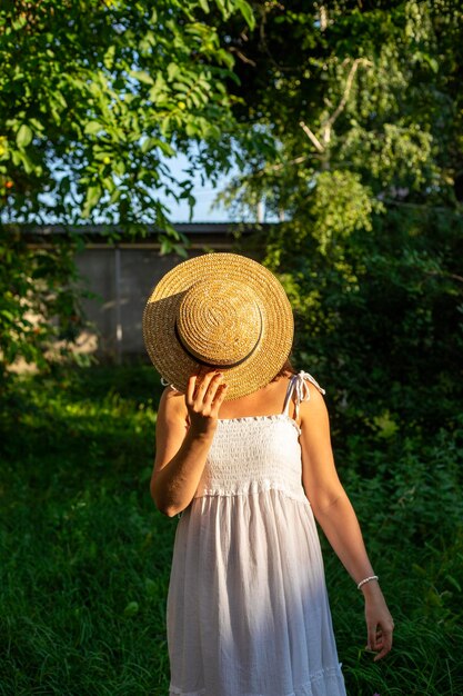 A girl on a picnic on a green meadow