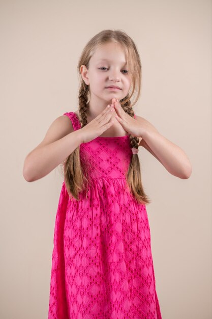 A girl in a pink dress with the word love on it