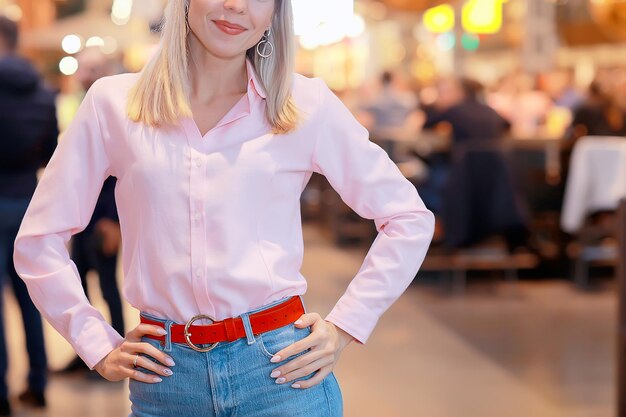 girl in a pink shirt element of clothing fragment, business style, cotton shirt, young woman