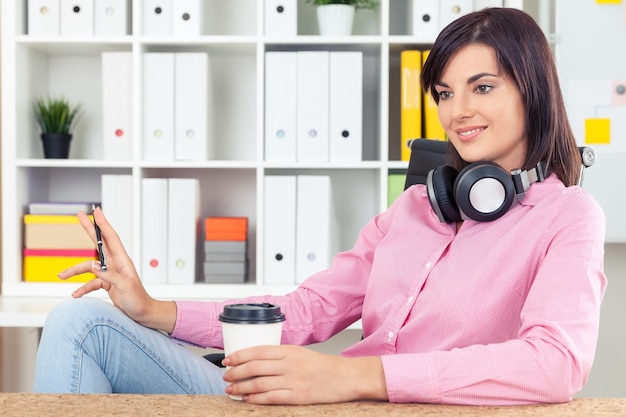 Girl in pink shirt is daydreaming