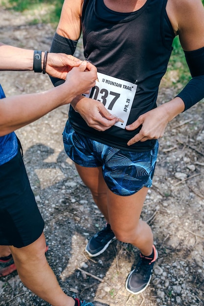 Girl placing the race number