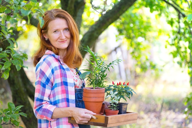 Girl plants a plant