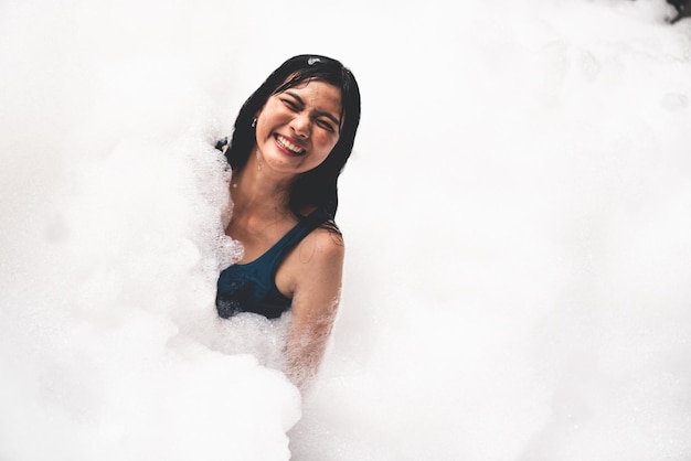 Girl playing in bubble pool with fun and joy