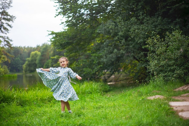 Girl playing by the river