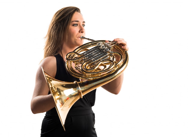 Girl playing the french horn