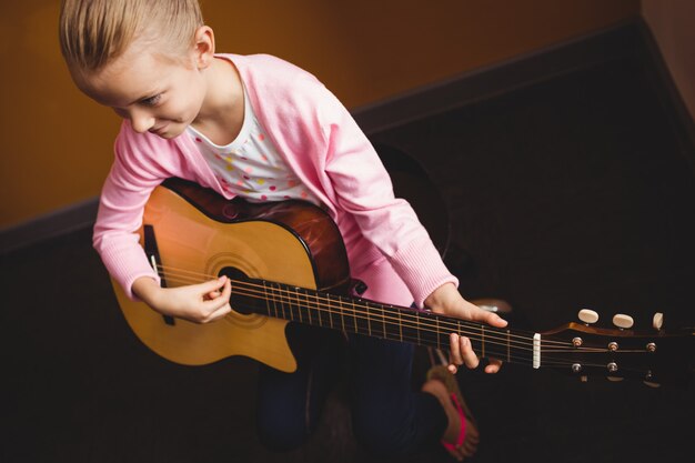 Girl playing the guitar