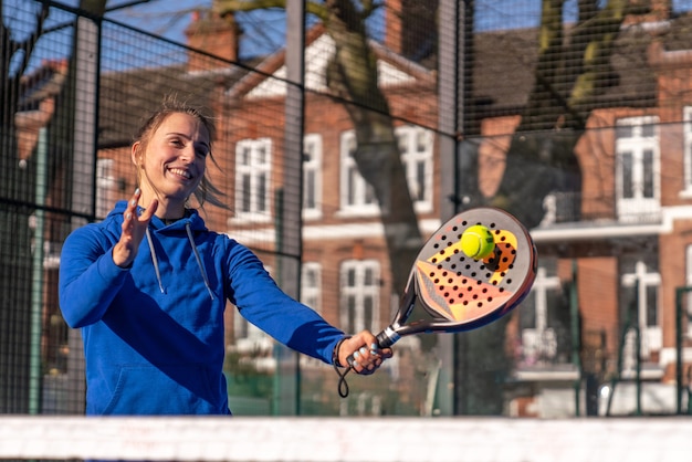 Girl playing paddle tennis