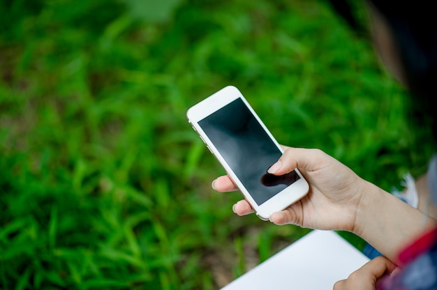 Girl playing phone on hand for online communication and contact