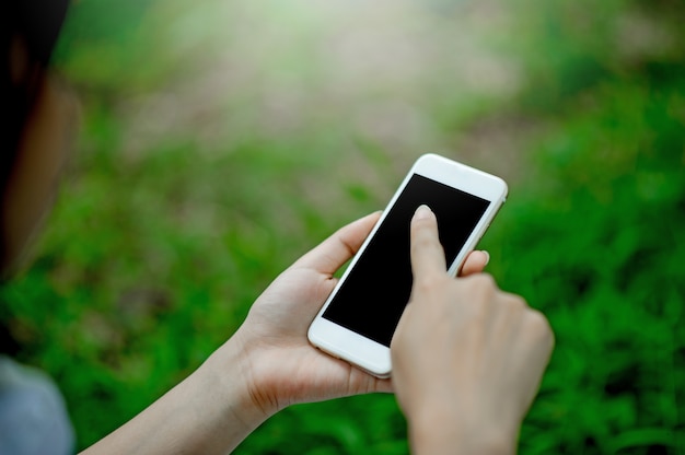 Girl playing phone on hand for online communication and contact