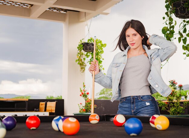 girl playing pool in the garden