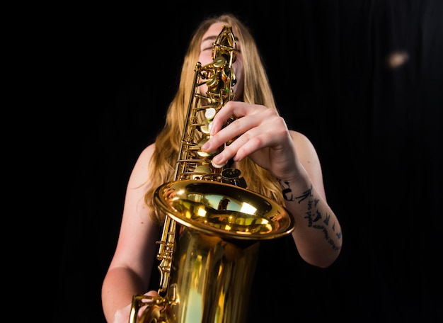 Girl playing the saxophone