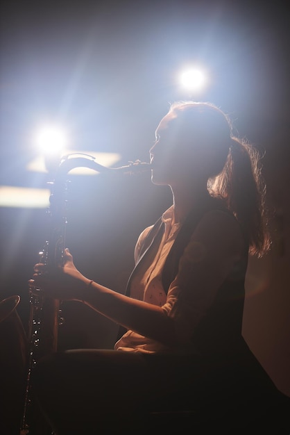 The girl playing the saxophone