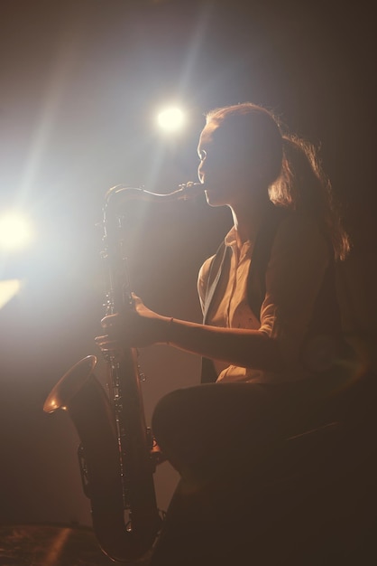 The girl playing the saxophone