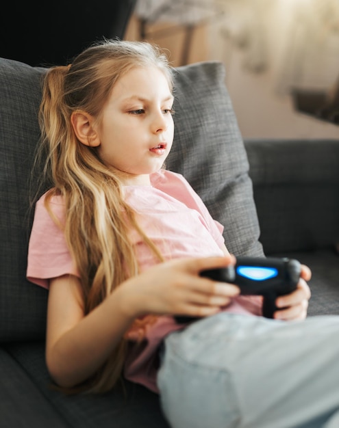 Girl playing video game at home