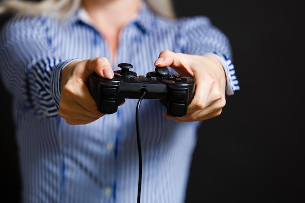 Girl playing video game with joystick.