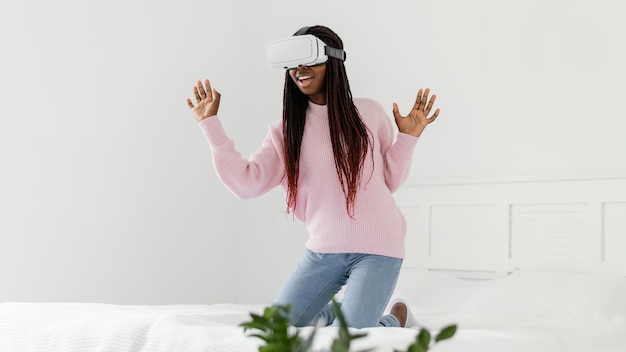 Photo girl playing videogames with vr glasses