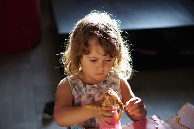 Girl playing with a doll