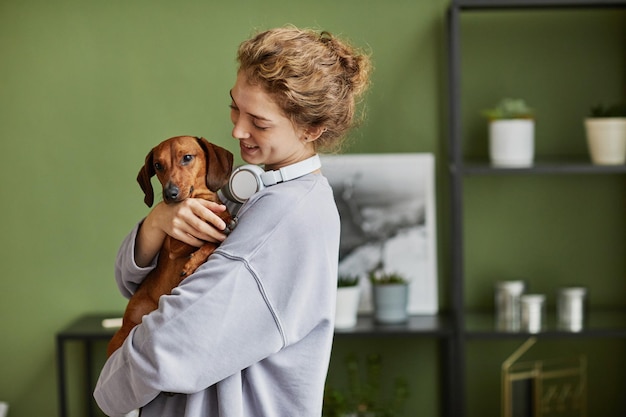 Girl playing with her dog