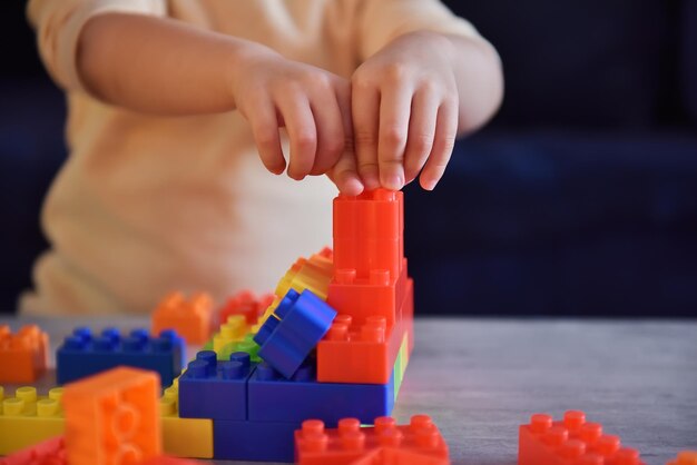 Girl plays constructor on desk