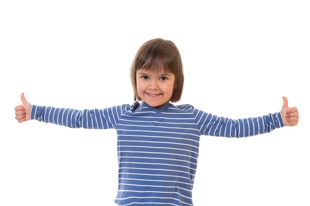 Girl pointing her thumb up on a white background