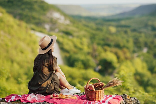 girl pondering over the valley and forest