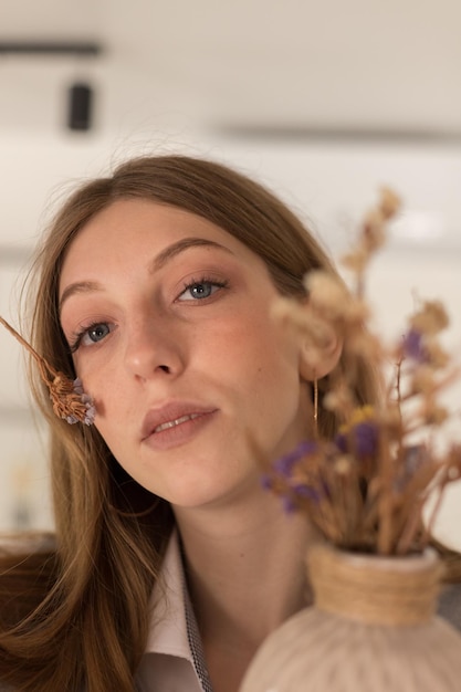 Girl portrait with dried flowers closeup