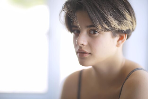 girl portrait young adult / unusual portrait of a girl with a strong character, studio contrast portrait