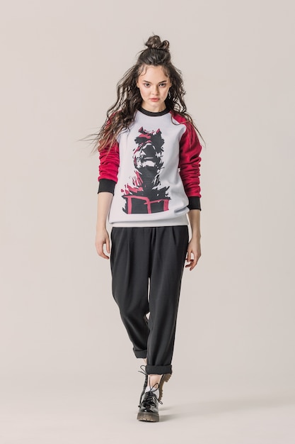 Girl posing full height in sweatshirt with Daredevil print.