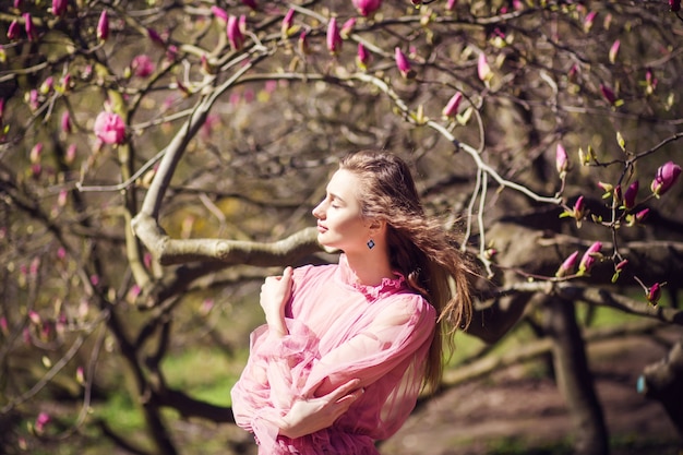 Girl posing in magnolia garden