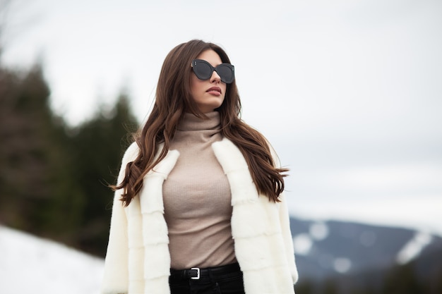 Girl posing on road on winter woods