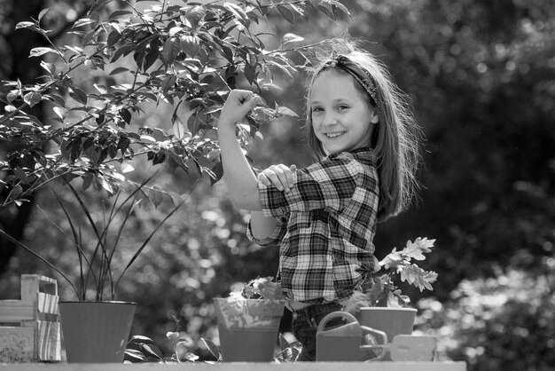 Girl power portrait of kid gardener carrying harvested in farm happy little farmer having fun on fie