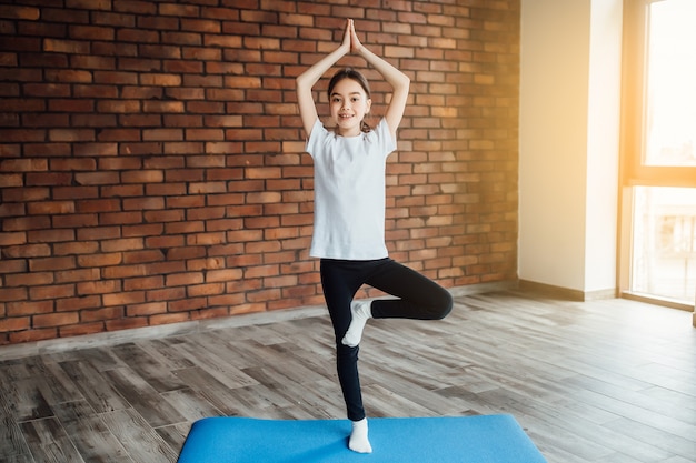 Girl practicing yoga stretching