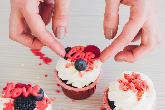 Girl prepares cupcakes