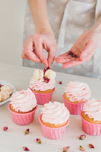 Girl prepares cupcakes