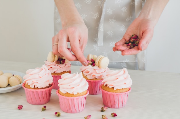 Girl prepares cupcakes