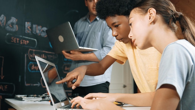 Photo girl programing or coding system while african boy fixing model edification