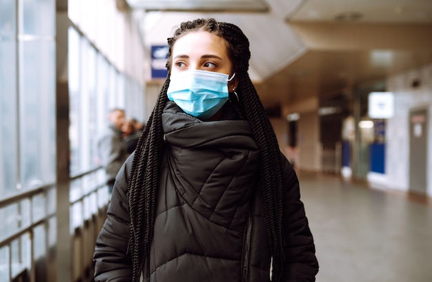 Girl in protective sterile medical mask