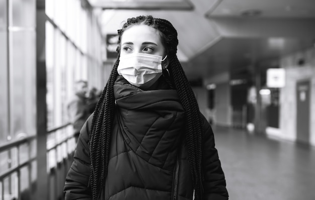 Girl in protective sterile medical mask