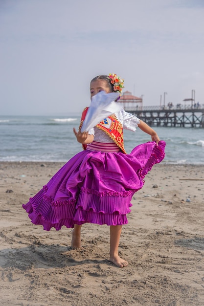 a girl in a purple dress with a dragon on the front