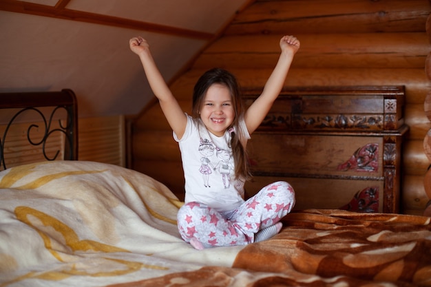 Girl raises her hands in joy