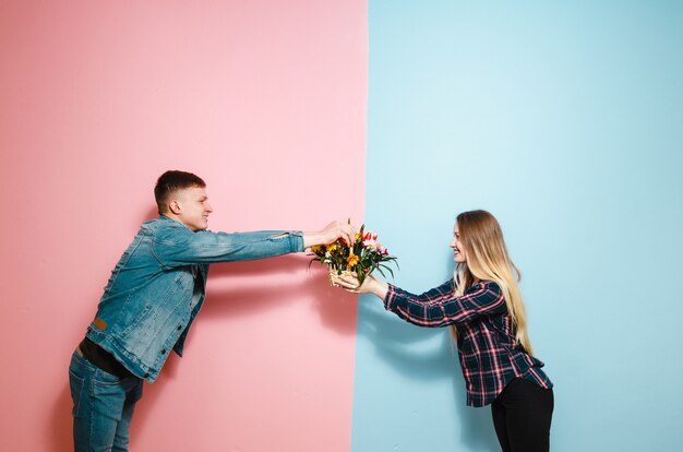 A girl receiving a gift basket with flowers