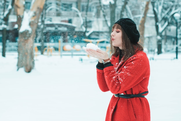 Girl in red coat in the snow Girl in red in the snow girl in the snow