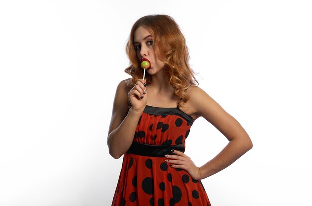 A girl in a red dress on a white background.fun and emotions.