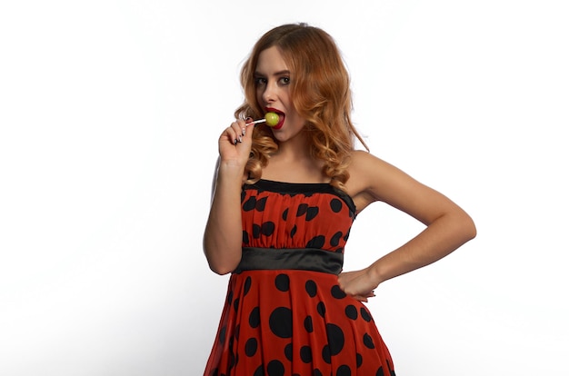 A girl in a red dress on a white background.fun and emotions.